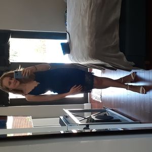 Spaghetti strap blue lace midi dress with lace up back and zipper.